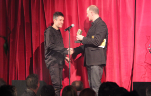 Richard Russell collects the award, on behalf of Damon Alburn, from Martin Warr of Synthax Audio UK